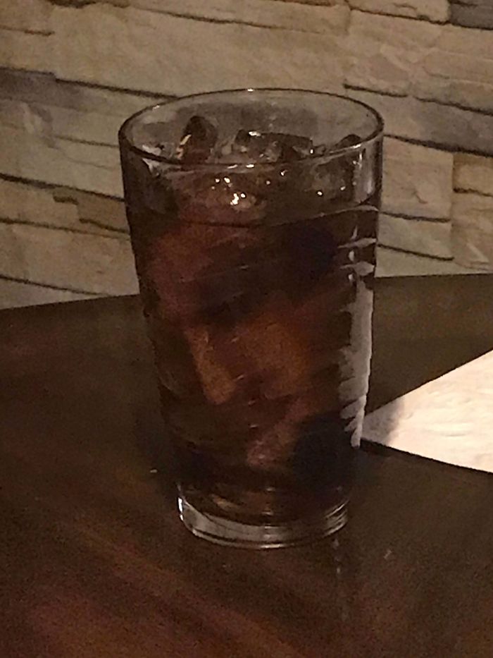 ice looks like human face in drink