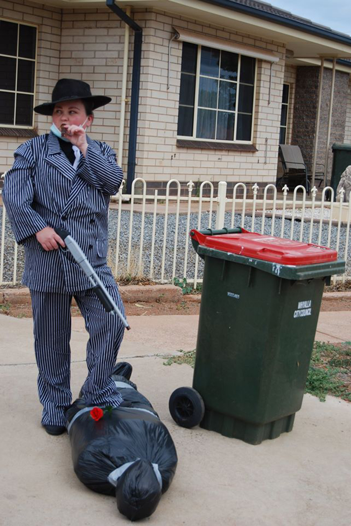 Bin Isolation Outing Woman Dressed as Mafia Member Taking Bin Out