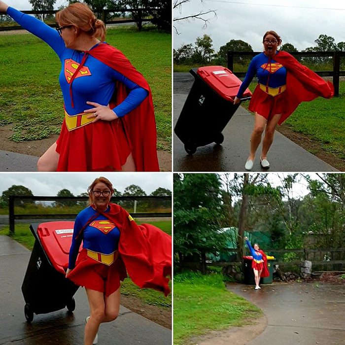 Woman Dressed as Supergirl Taking Trash Out