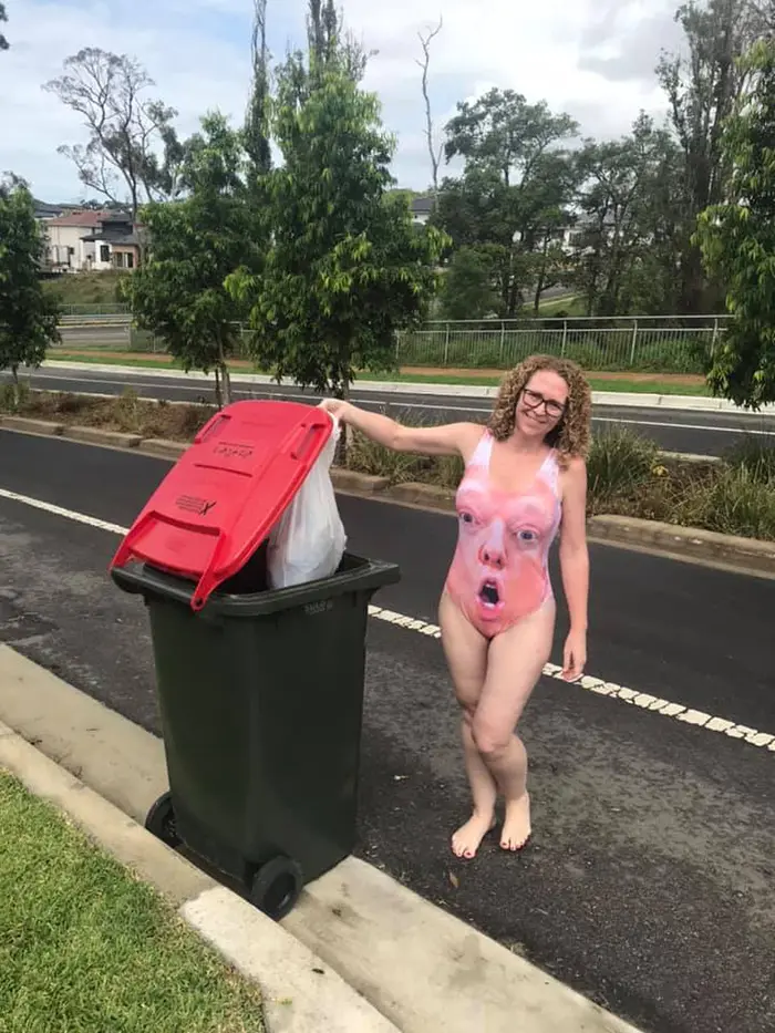 Woman in Trump Swimsuit Taking Trash Out