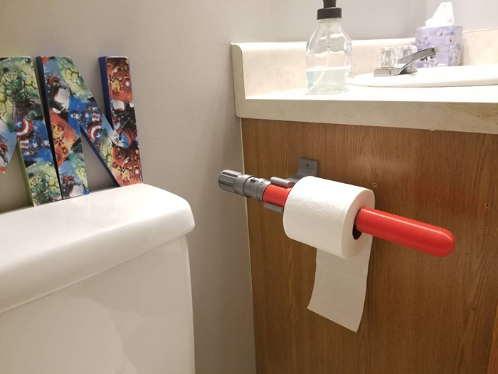 lightsaber mounted toilet paper holder