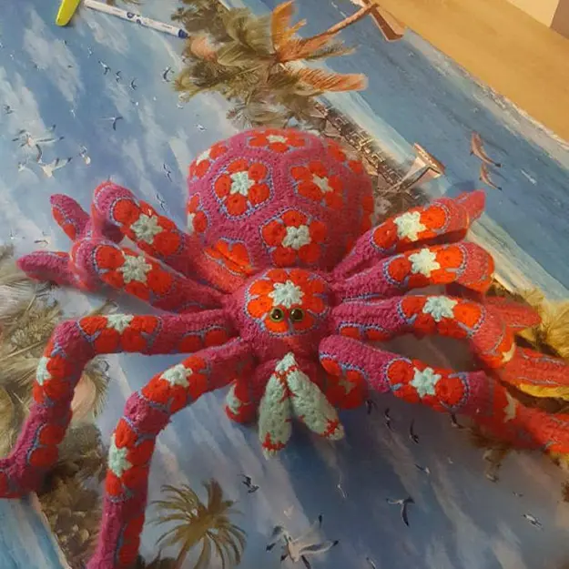 pink spider with orange flowers