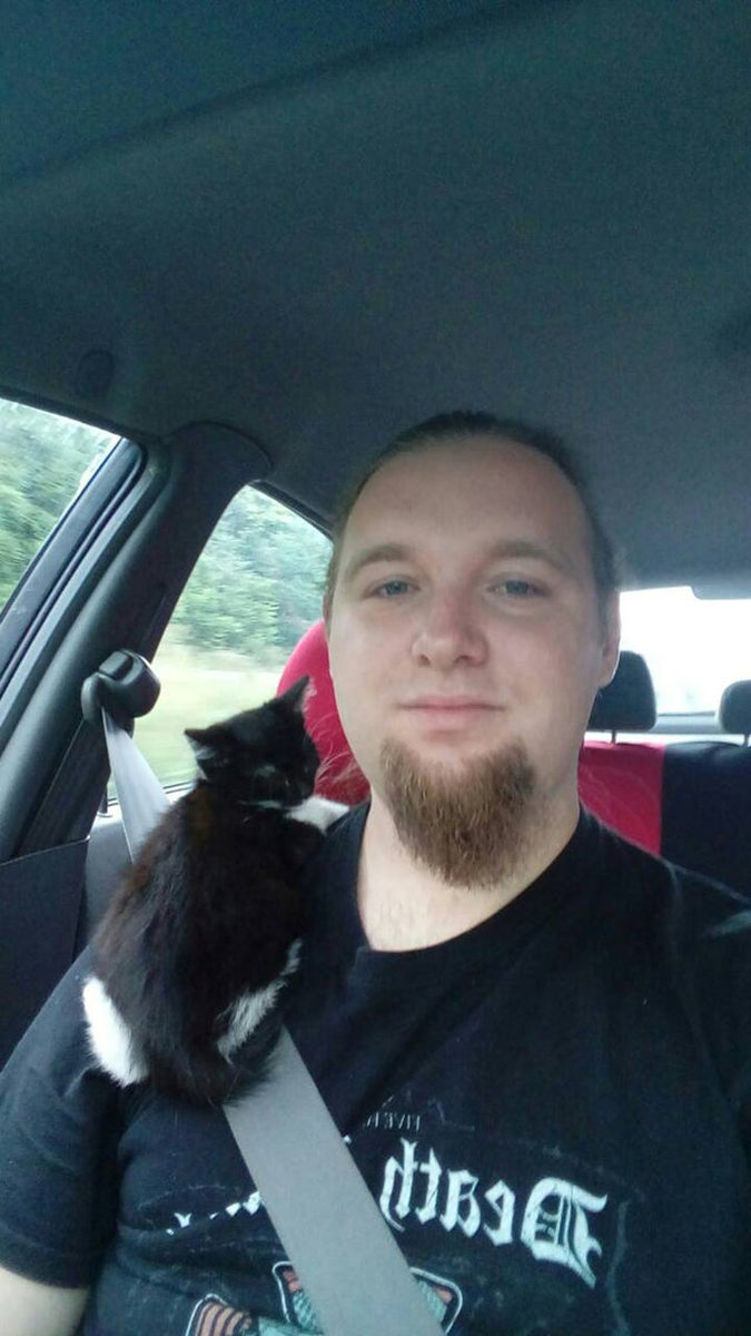 rescue pet photos-kitten rides on her new human's shoulder