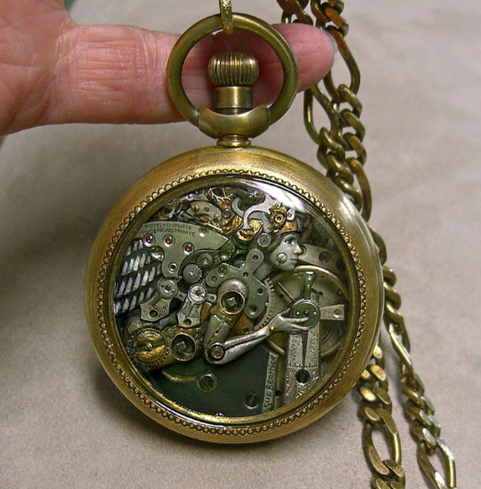 sculpture of a woman inside a pocket watch case