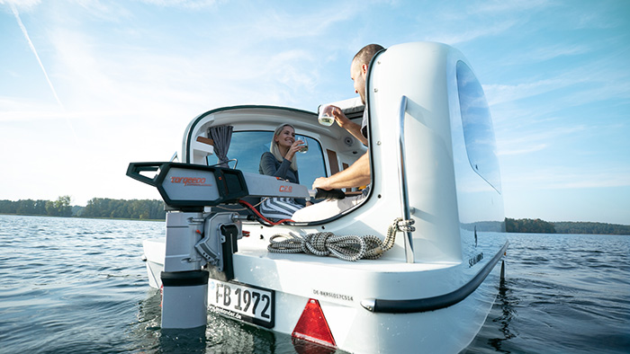 couple aboard the sealander enjoying champagne by the lake