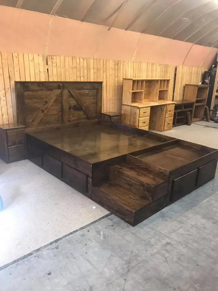 wooden king bed with dog bed and nighstands in dark walnut