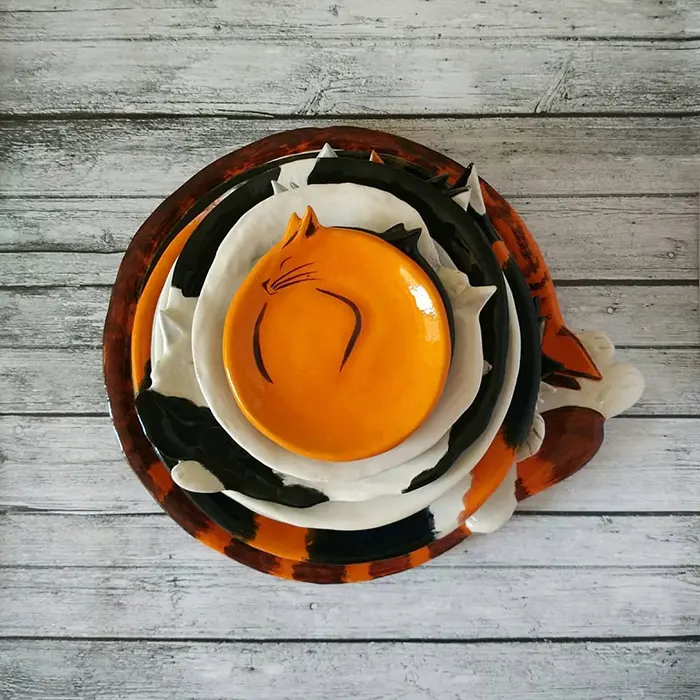 Stack of Curled Up Feline Dishes