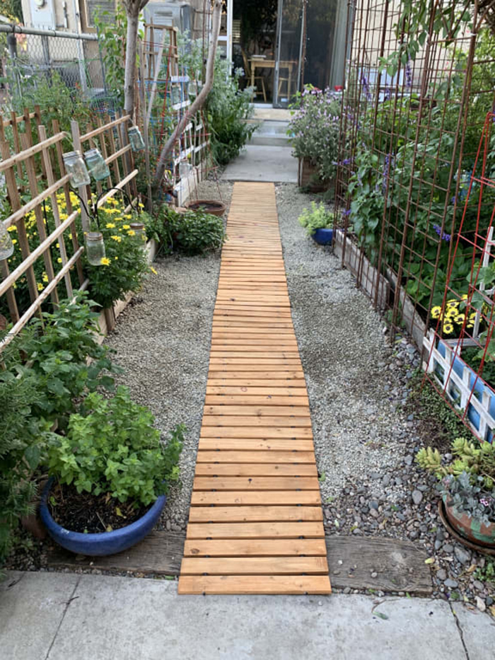 straight hardwood planks garden pathway