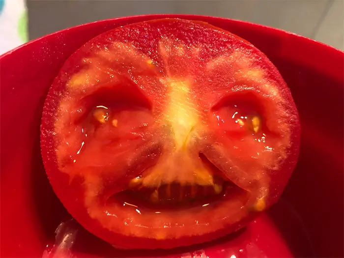 funny pareidolia crying tomato slice