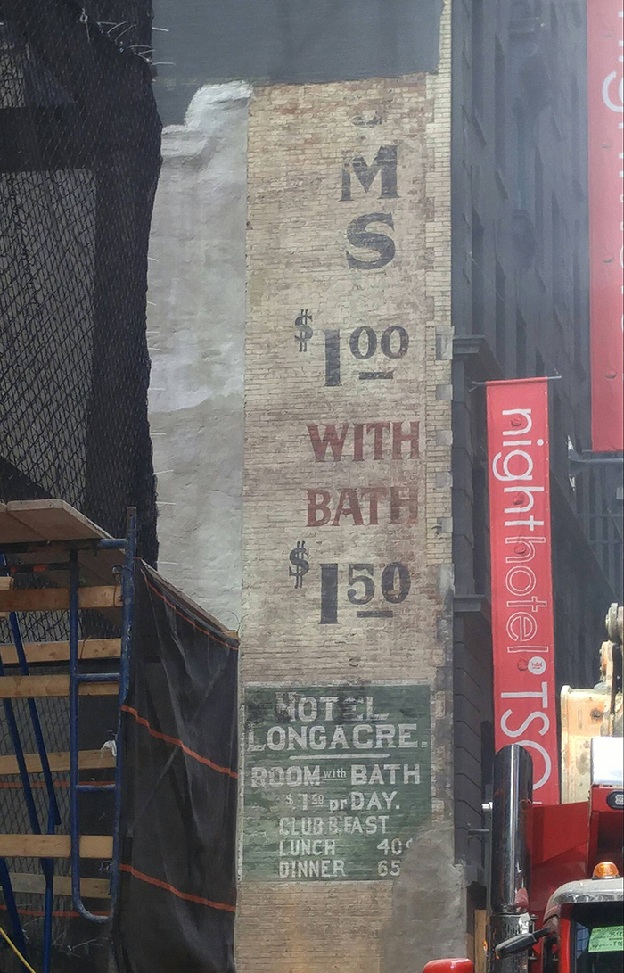 hotel advertisement found at a times square construction site