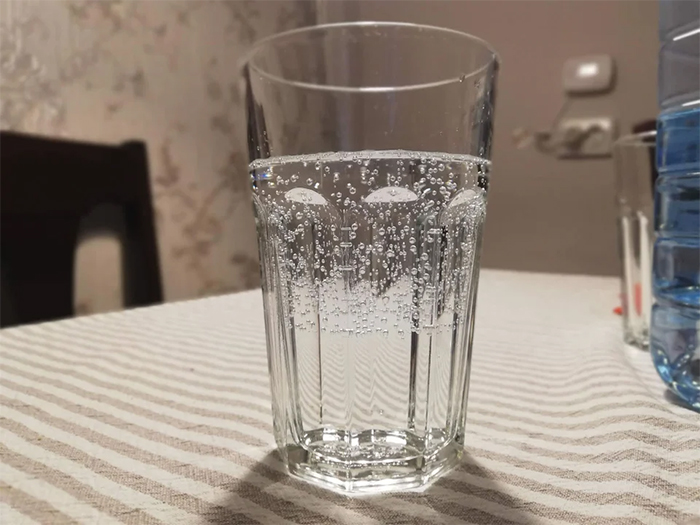 sparkling water poured over tap water