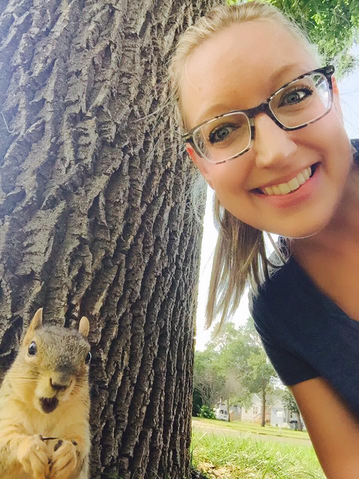 woman taking a selfie with squirrel