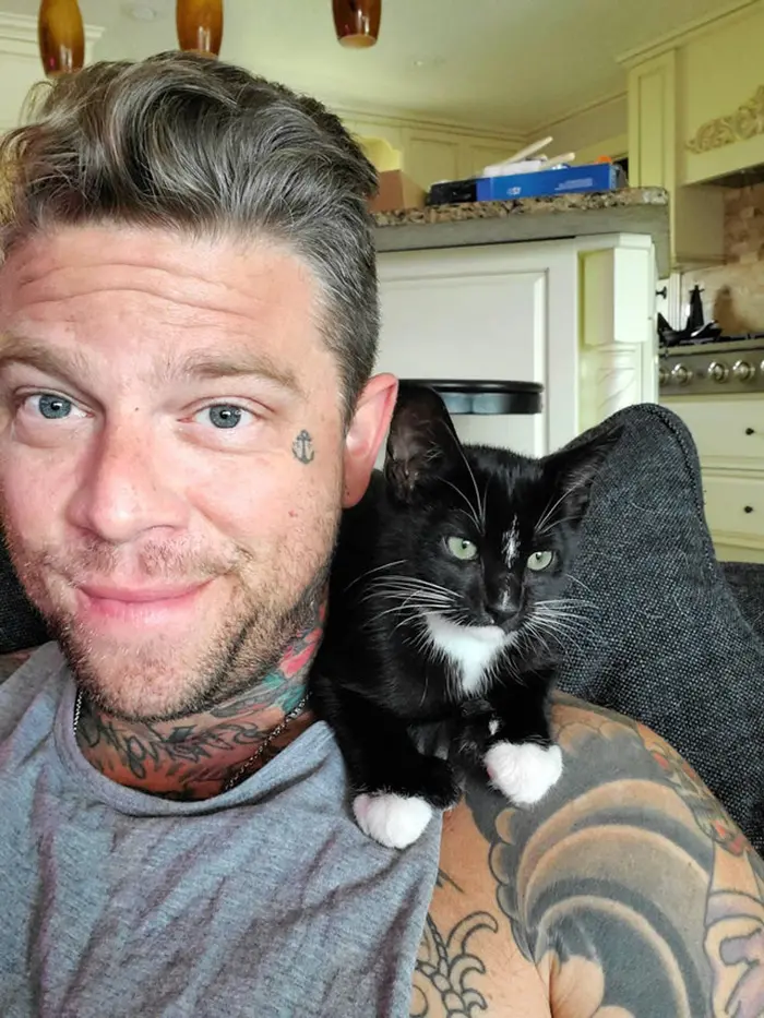 wholesome cat posts man with cat on shoulder