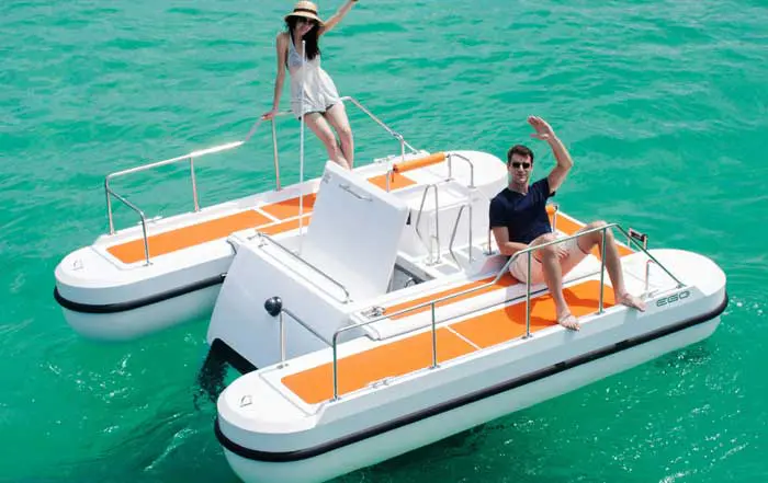 couple relaxes atop the EGO compact semi-submarine