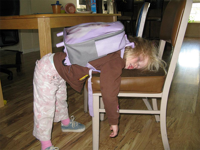 girl exhausted hard day at school