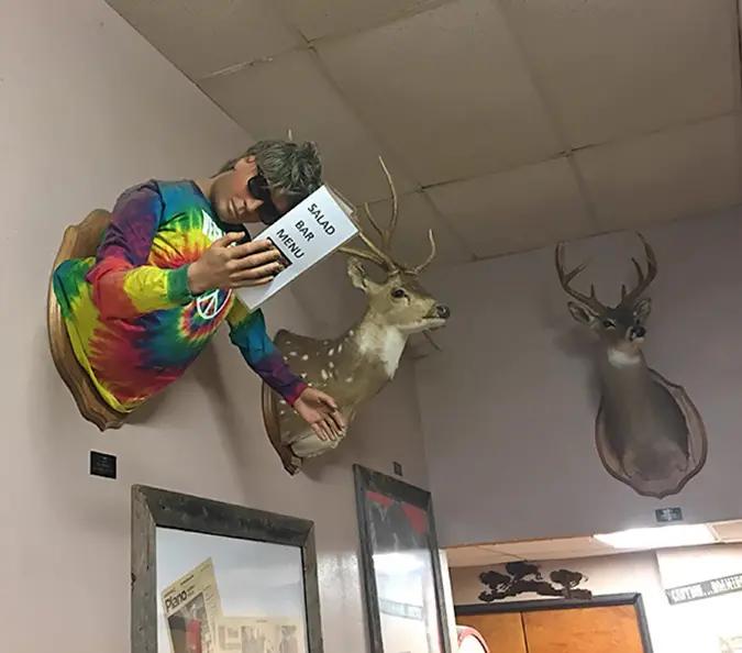 local butcher mounts a mannequin on wall