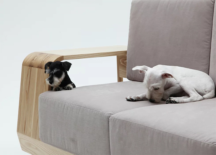 sofa with large wooden armrest pet house