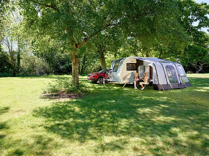 two ladies eating outside a bailey discovery d4-2 camper trailer