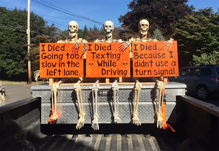 back truck skeleton spooky traffic reminder