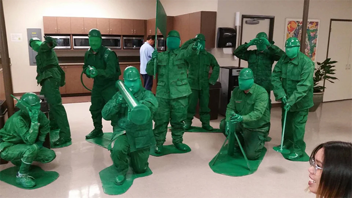 guys dressed up as tiny toy soldiers