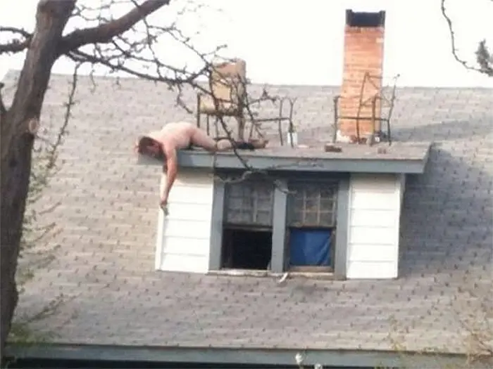 man drunk on the roof