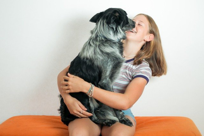 pixabay-girl-cuddles-with-dog