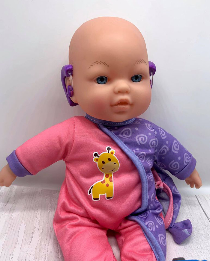 baby doll with hearing aid