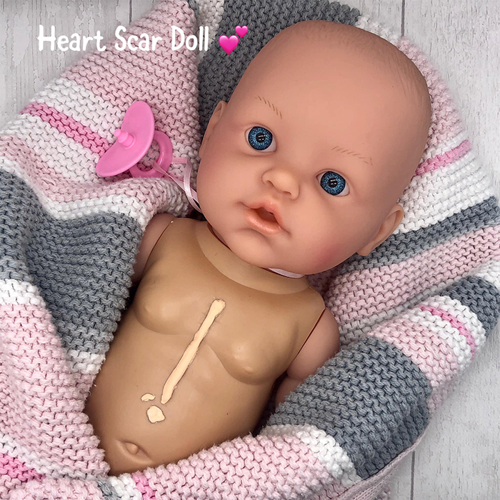 baby doll with heart scar