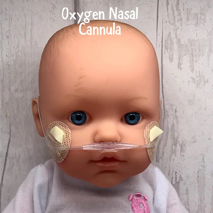 baby doll with oxygen nasal cannula