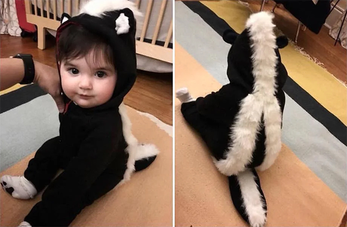 baby in skunk outfit