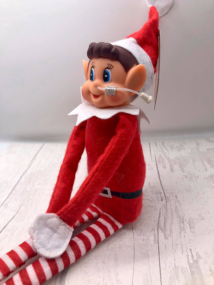 christmas elf toy figure with a nasogastric tube