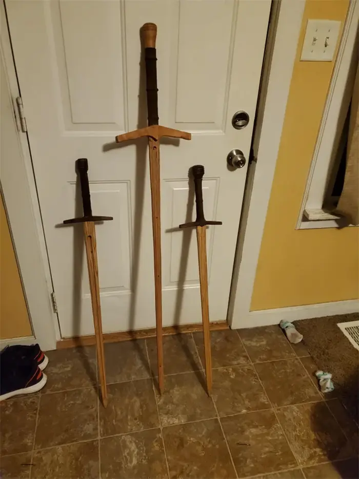 creative father creates wooden swords