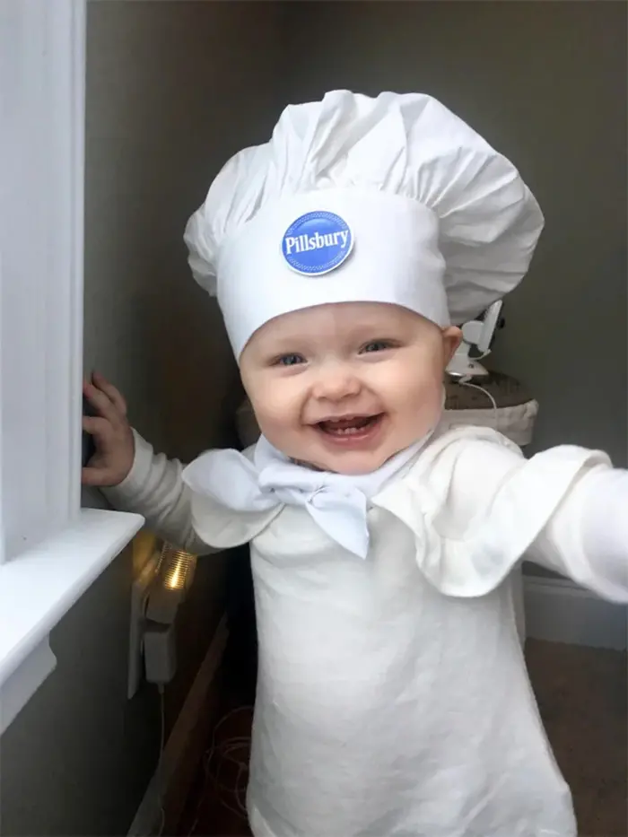 cute baby dressed up as pillsbury mascot