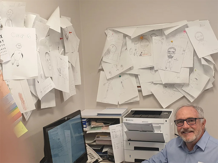 doctor keeps kids drawings of him