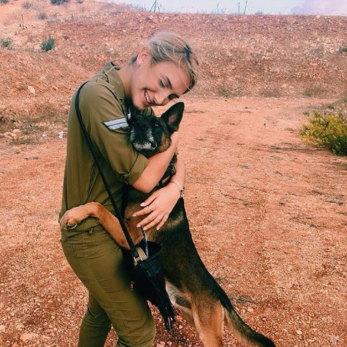 lady hugging a german shepherd