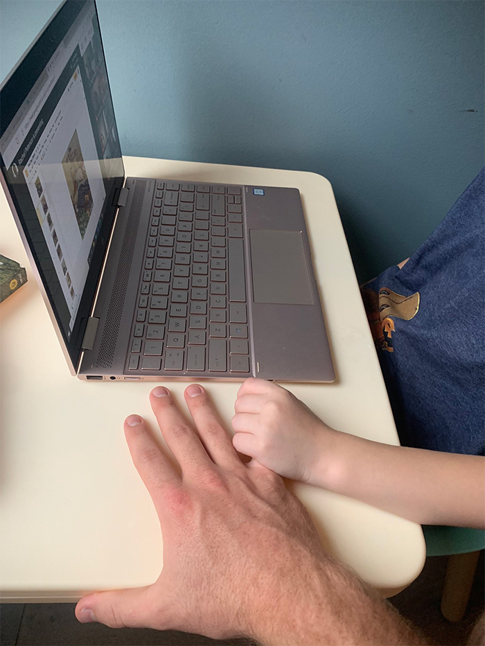 nanny comforts nervous kid first online class