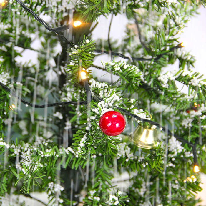 pre-decorated christmas tree with snowing feature