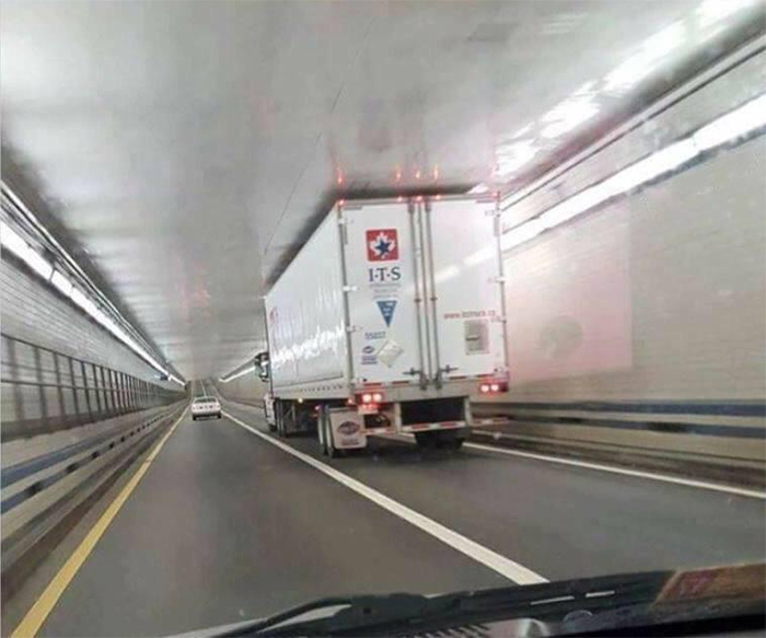 truck perfectly fits into a tunnel
