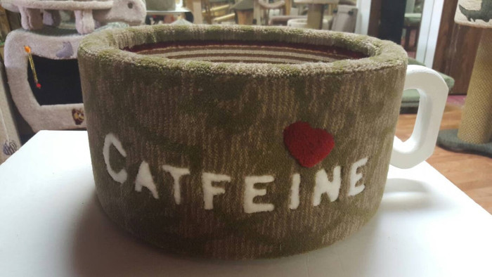 brown and moss green mug-shaped cat bed