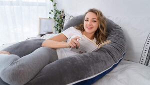 This C-Shaped Pregnancy Pillow Supports Your Bump While You Sleep