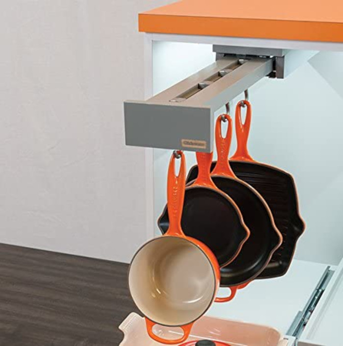 glideware sliding pot holder in grey with orange cookware