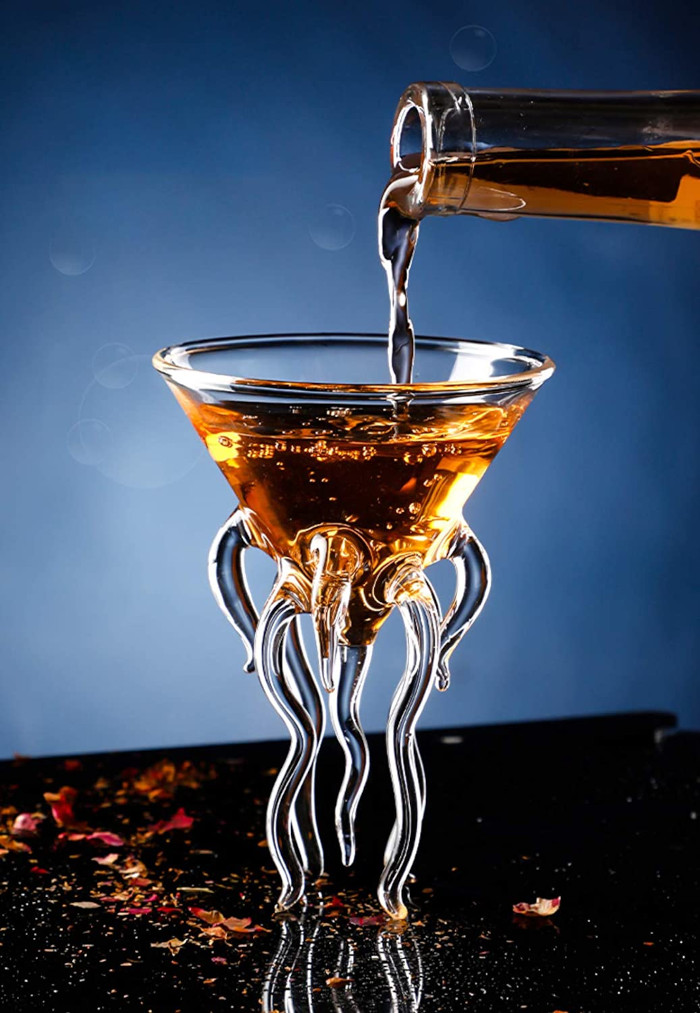 liquor being poured into the jellyfish glass