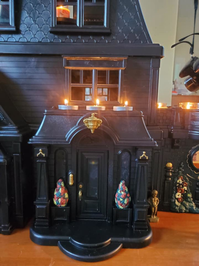 matte black tpy with subtle colorful details and lit candles