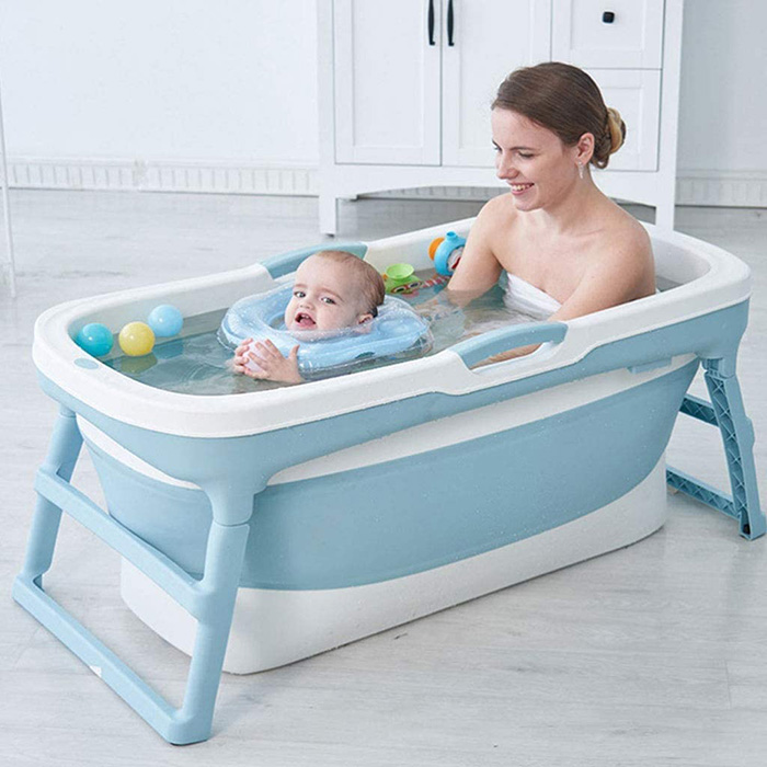 mom and baby soaked in collapsible spa tub