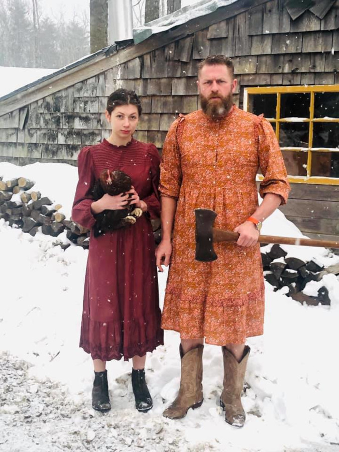 Cheri Lawrence Grovestein and husband in red and orange version of the Target prairie dress for their roasting