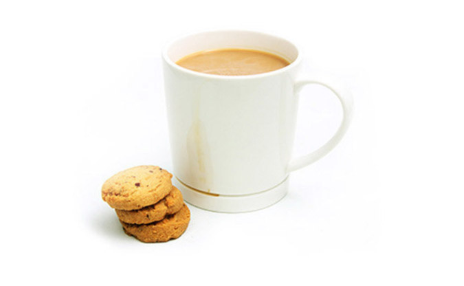 Drop-Rest Coffee Mug alongside a stack of cookies