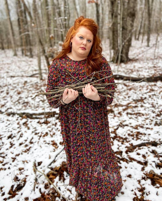 Emily McCallie Wiggins wears a red variation of the Target dress being roasted by the internet