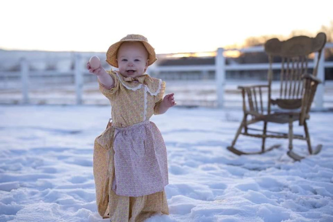 Melissa Tomas' young tot happily joins in on the family roasting of the Target prairie dress line