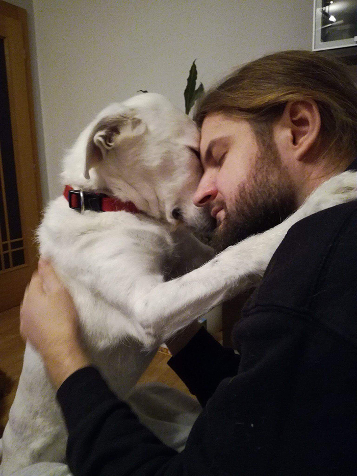 boyfriend hugging dog