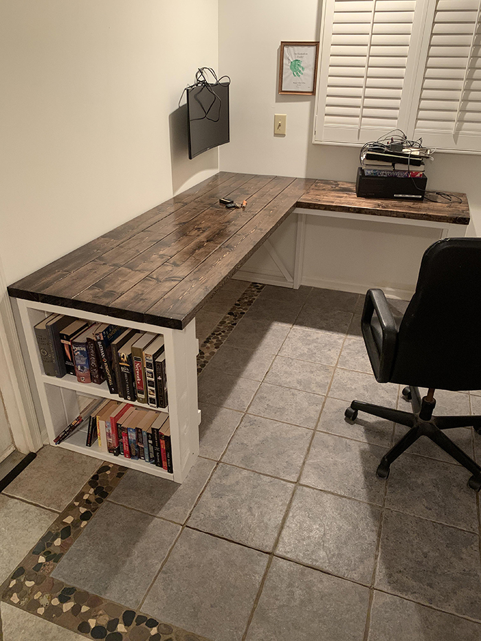 wooden desk with bookshelves